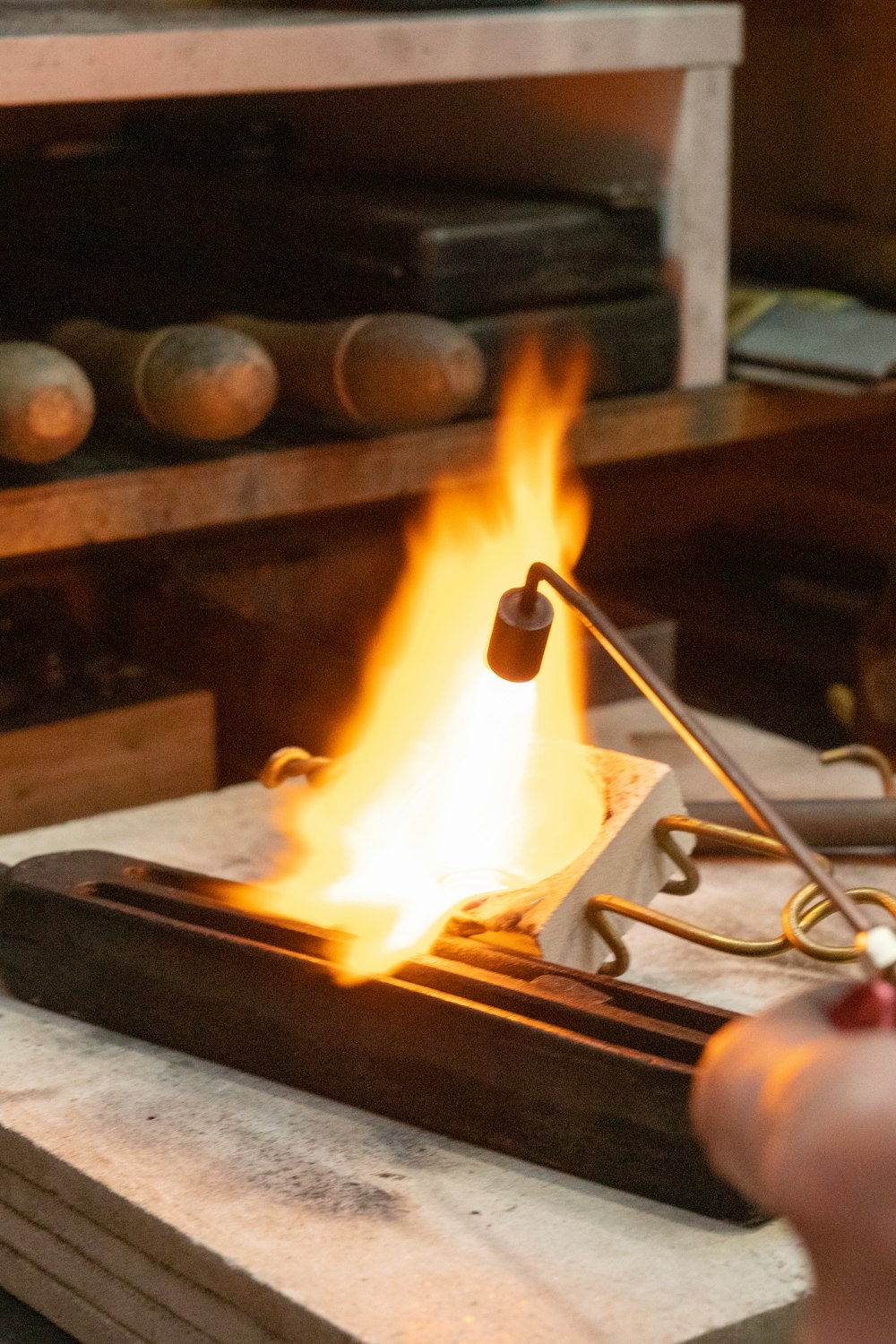 a hand holding a fire