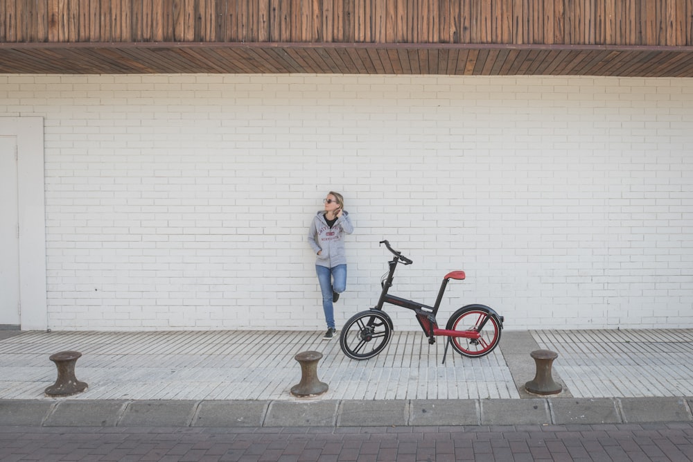 a person standing next to a bicycle