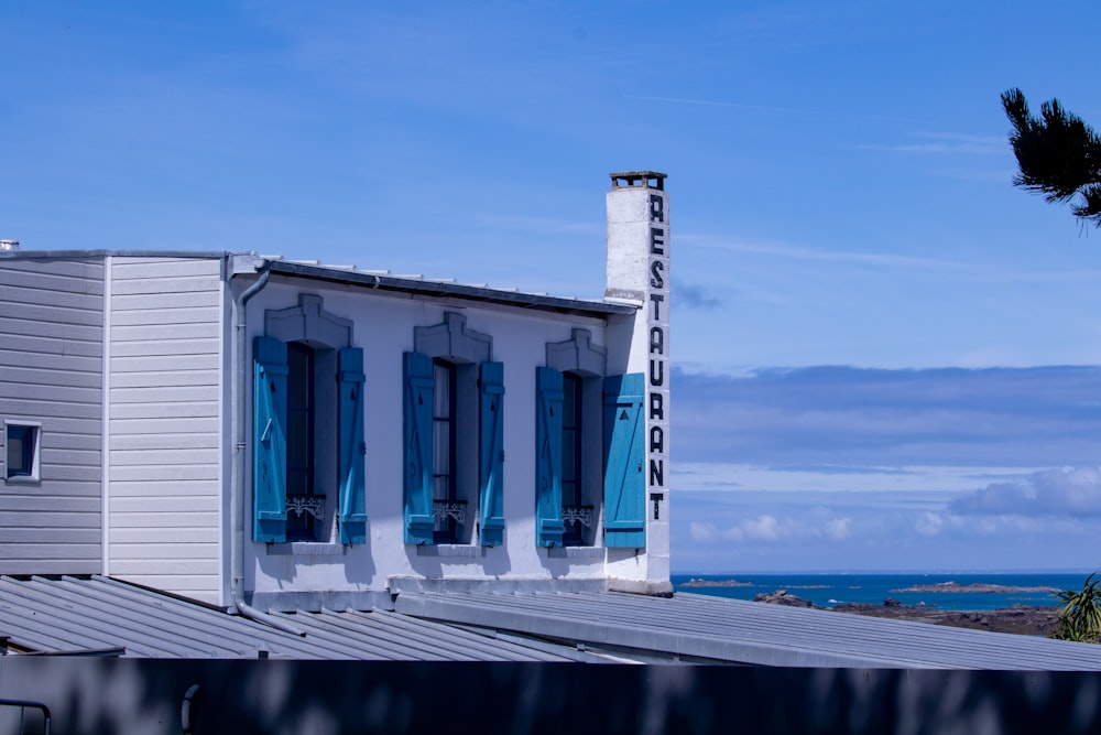 a white building with blue doors