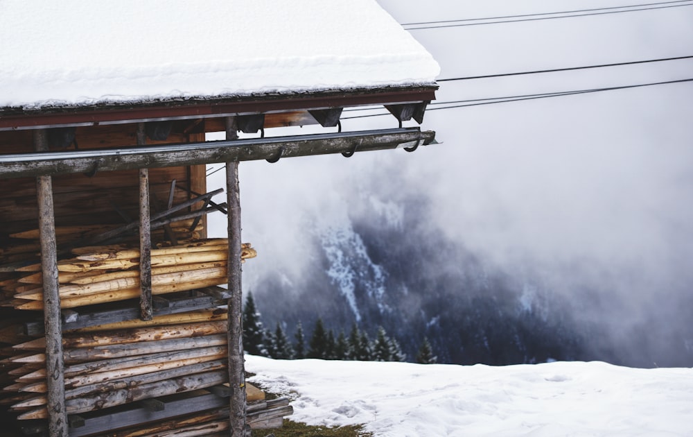 a wooden structure with smoke coming out of it