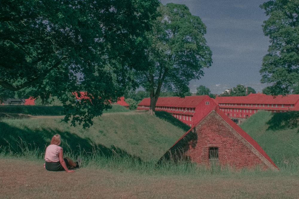 a person sitting on a hill