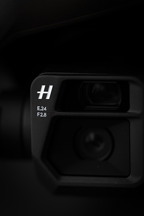 a black camera with a lens