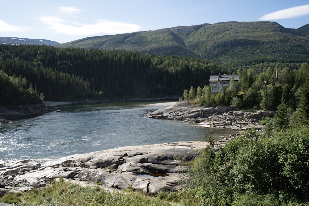 a river with a house on the shore