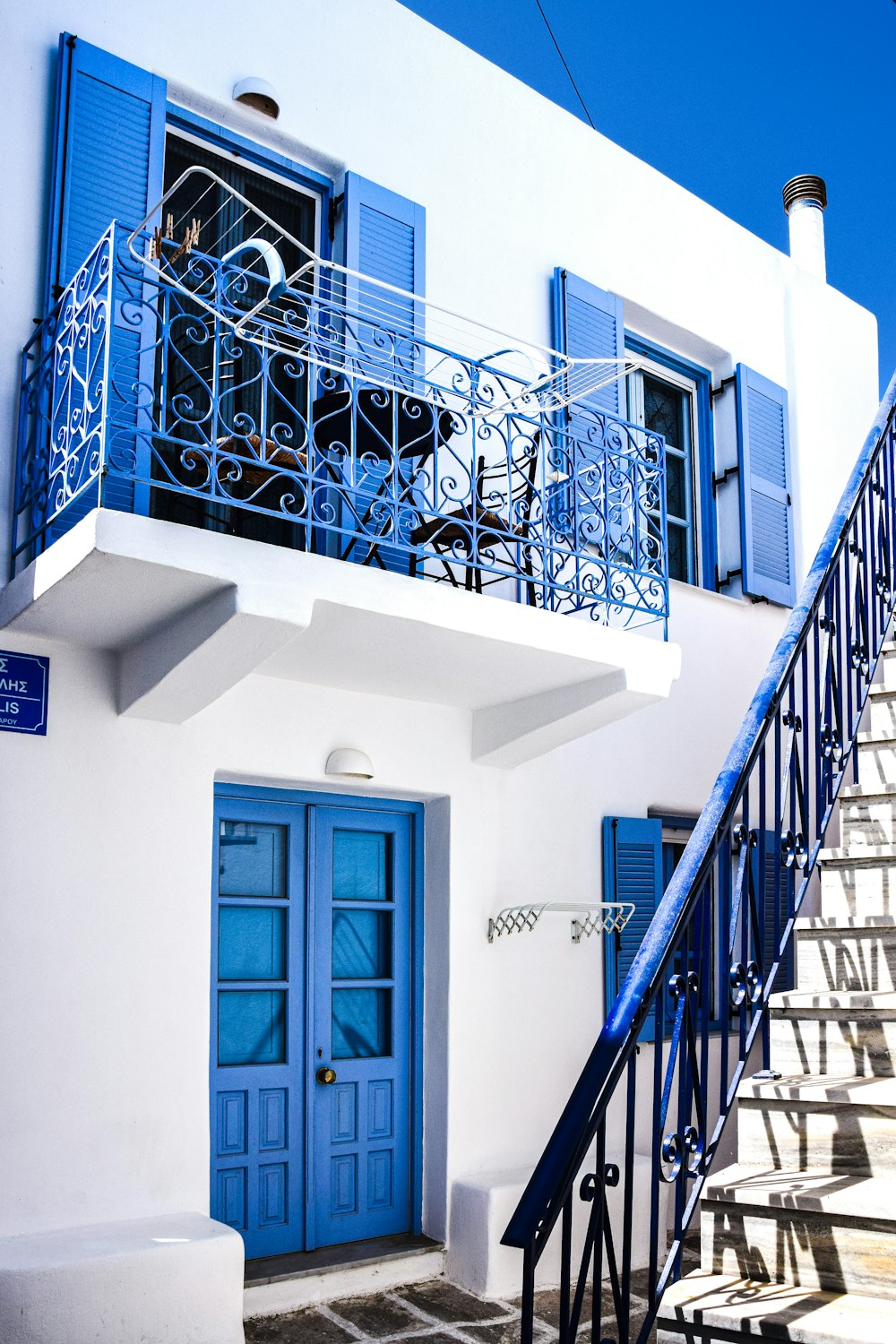 a building with blue doors and stairs