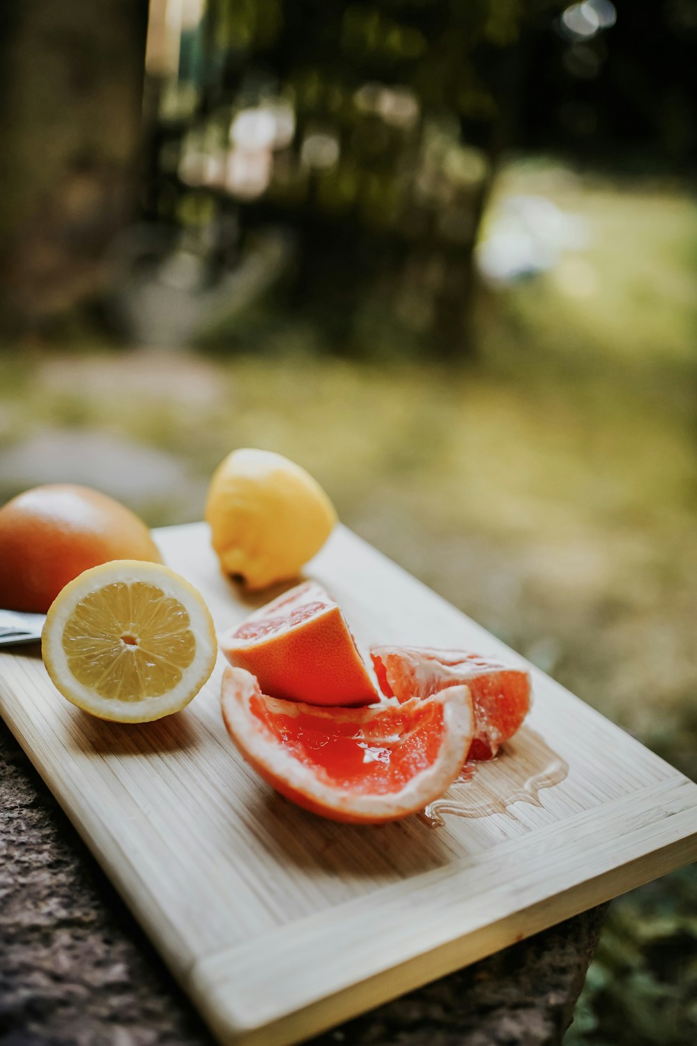 a group of fruits on a cutting board