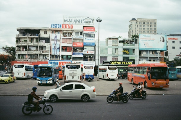 A vibrant street scene in Brazil with cars and motorcycles representing urban mobility.