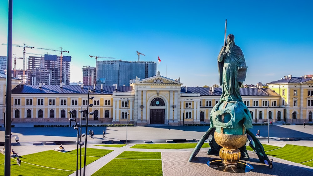 a statue in front of a building