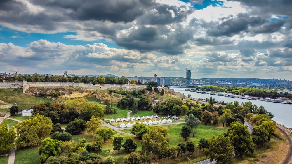 a park with a body of water in the background