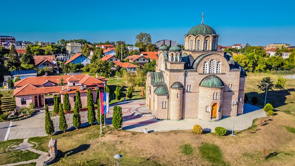 a building with a dome and a flag in front of it