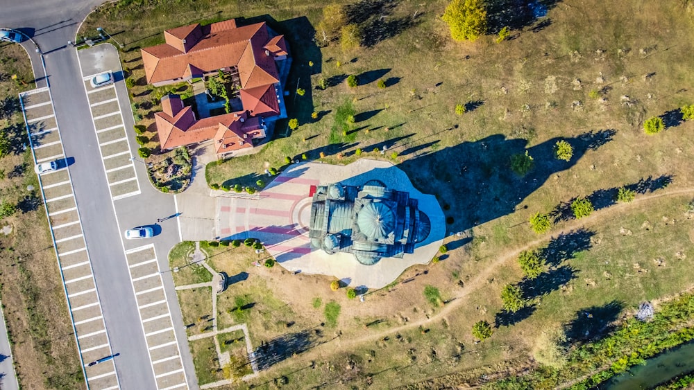 a house with a pool in the middle of a field