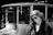 a person in a fur coat and sunglasses leaning on a bus