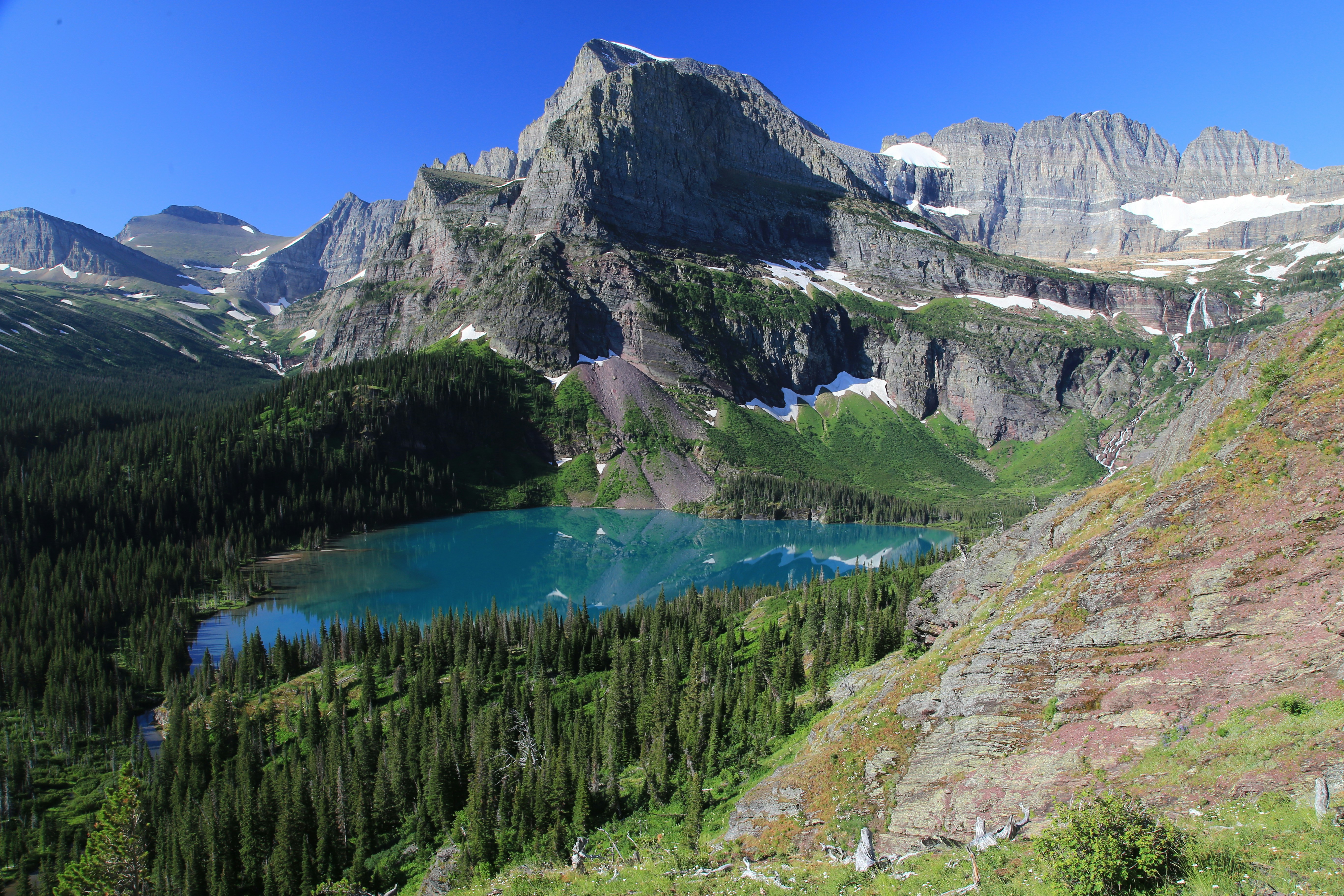 a lake surrounded by mountains