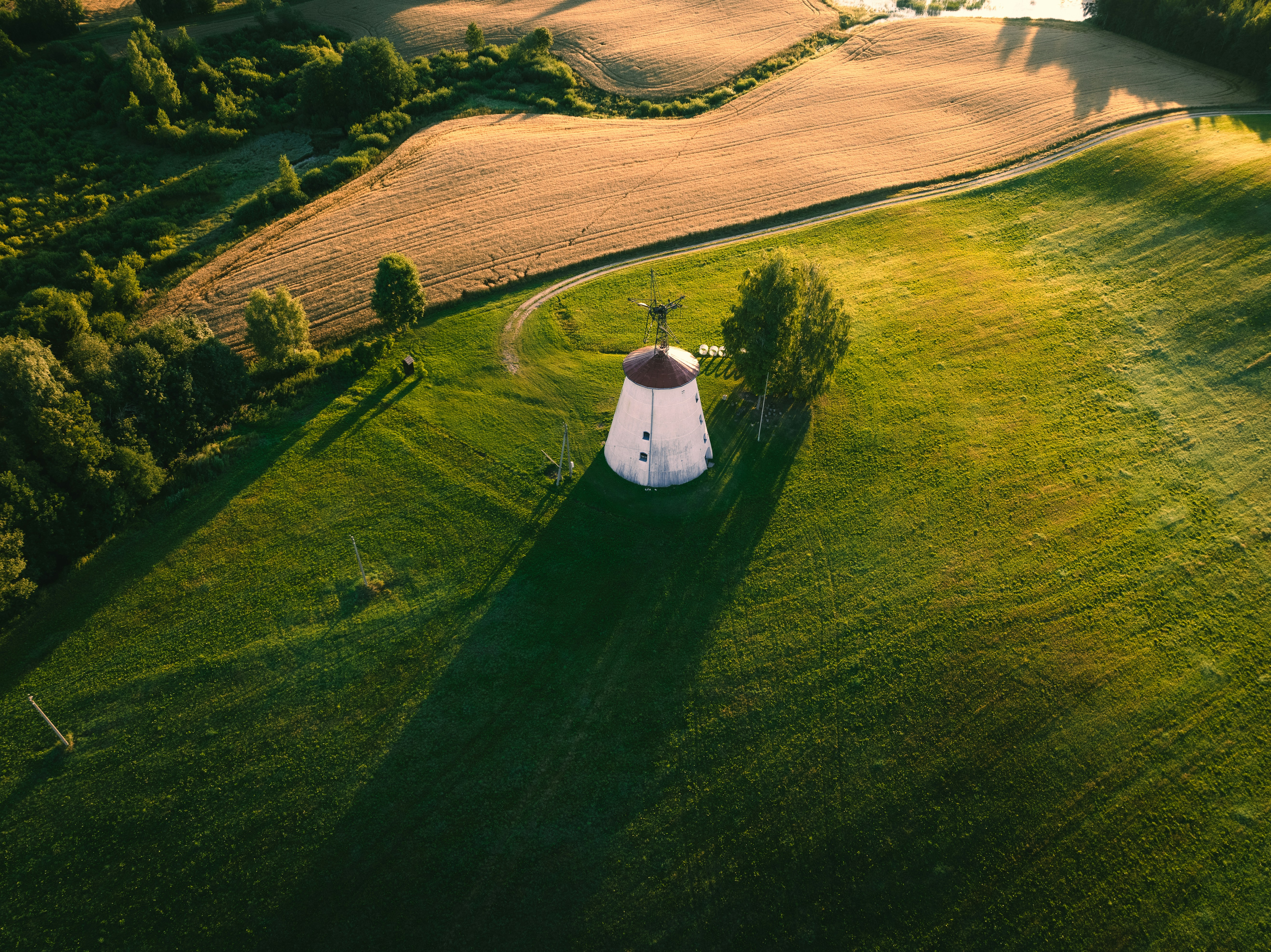 A building in a field photo – Free Latvia Image on Unsplash