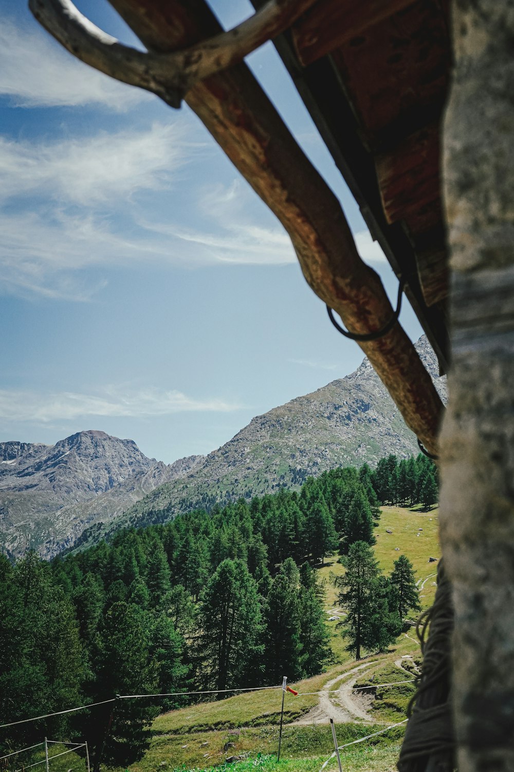 a view of a mountain from a stone archway