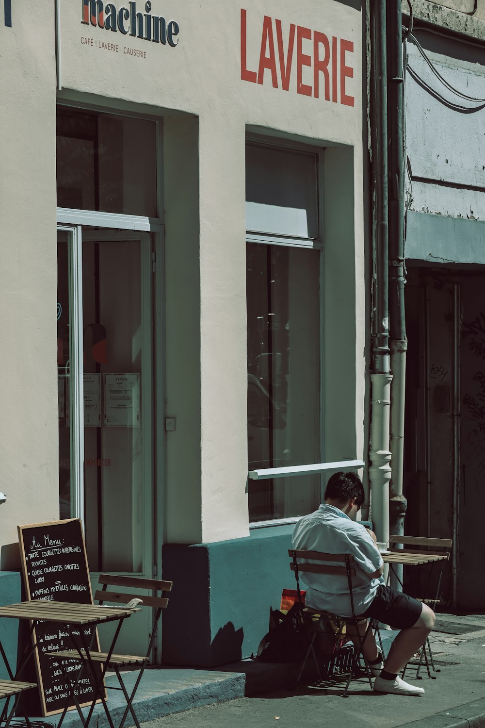 a person sitting outside a building