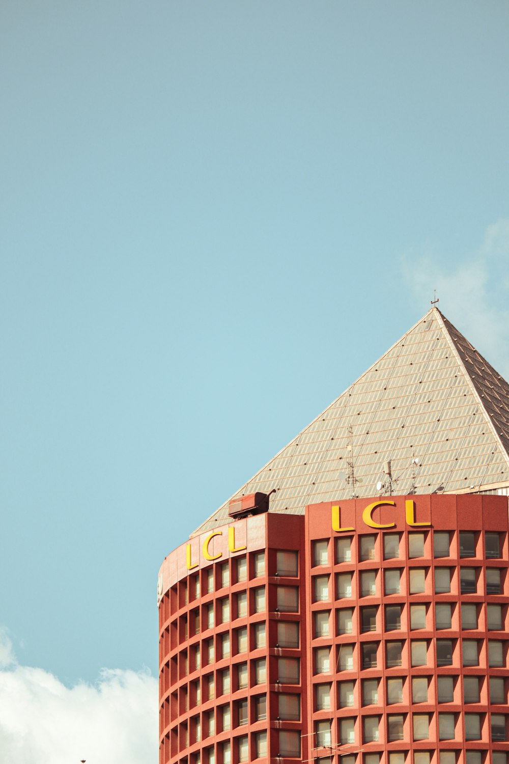 a tall building with a blue sky