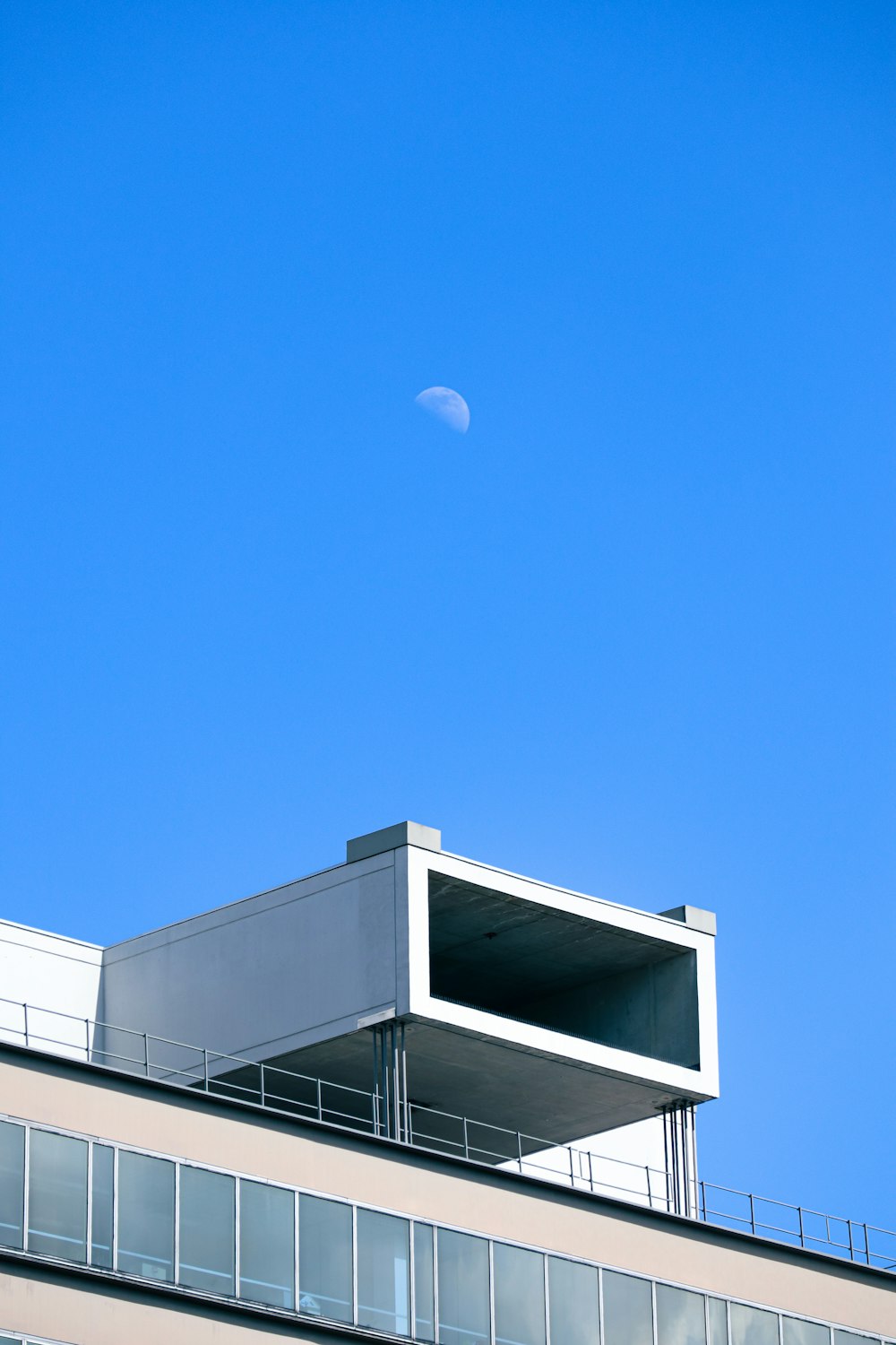 a building with a moon in the sky