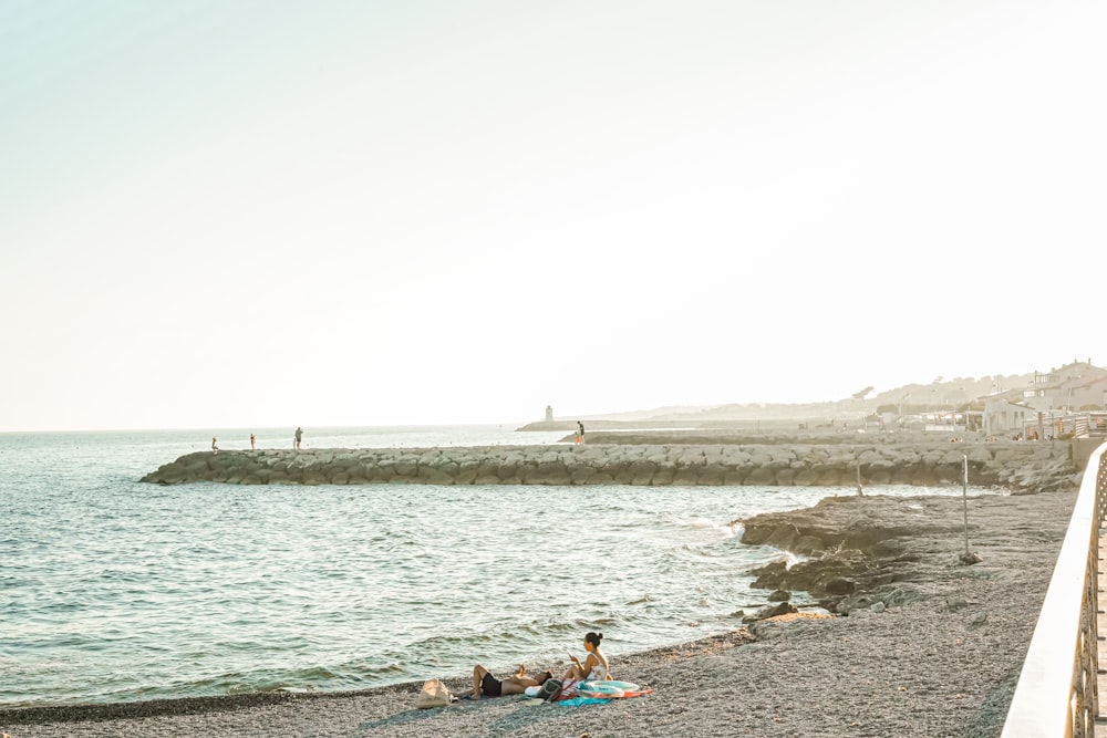 people lying on a beach