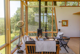a dining room table in front of a window