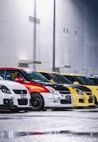 A row of colorful car fenders lined up in a well-lit auto parts store