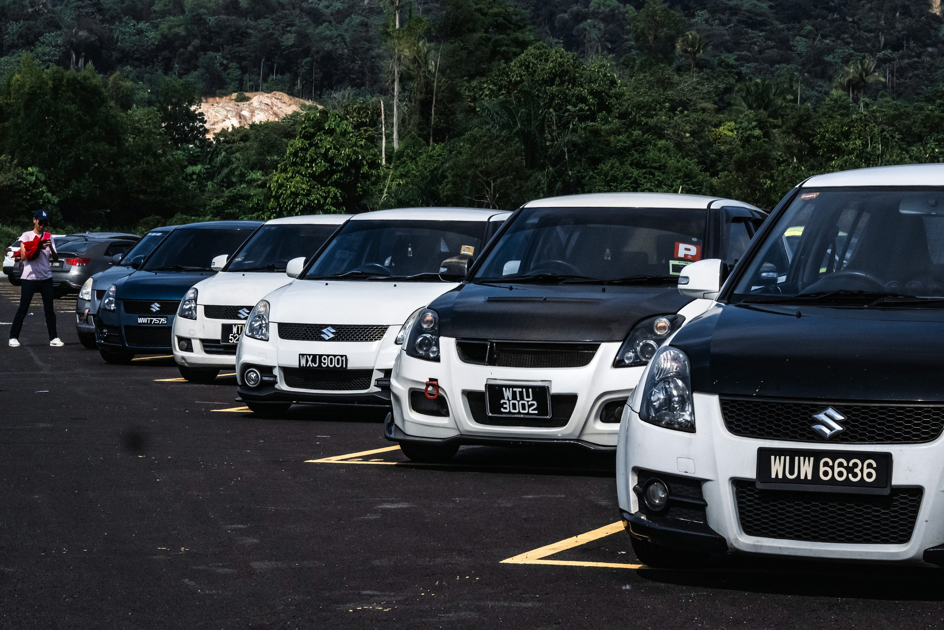 a group of cars parked in a parking lot