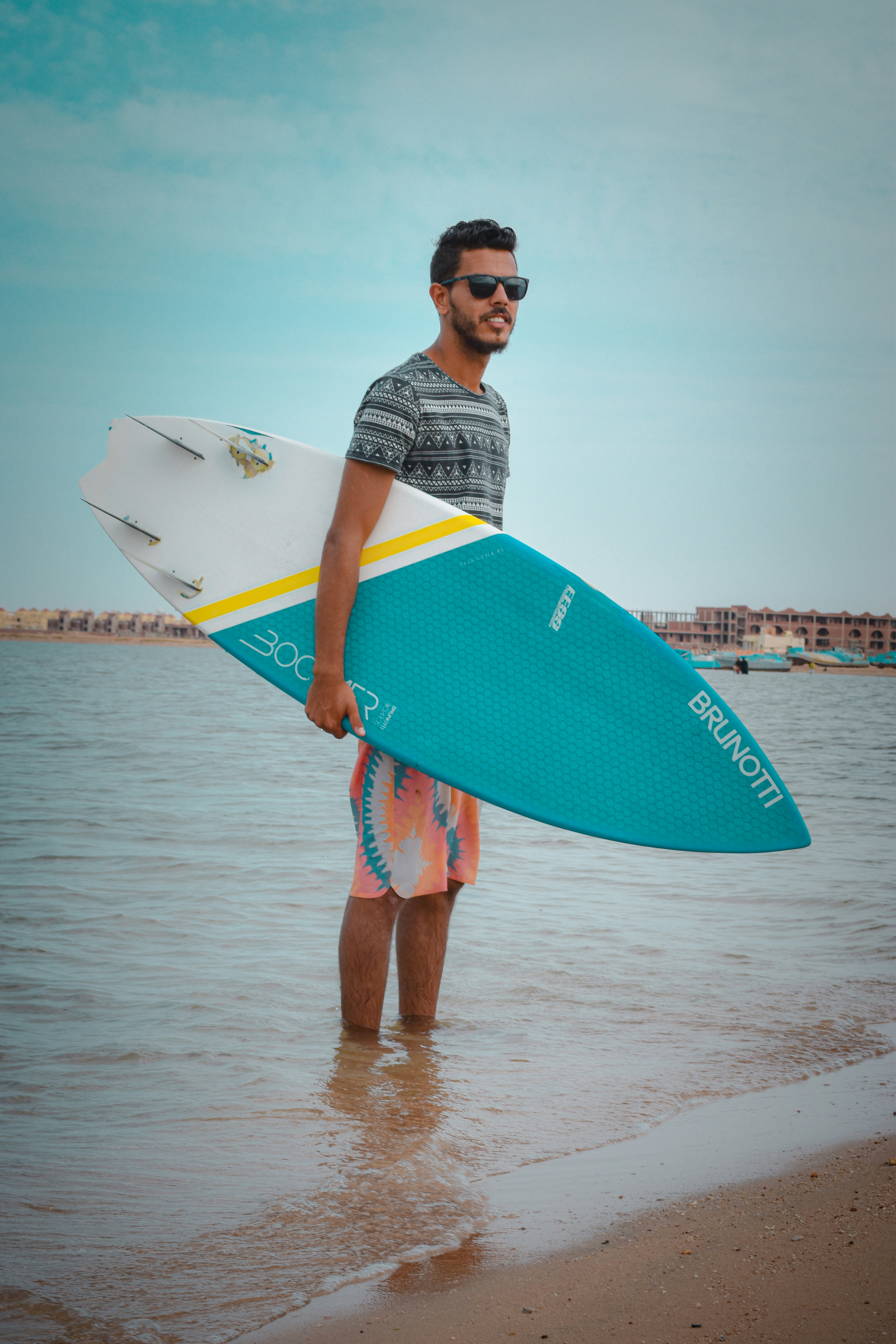 a man holding a surfboard
