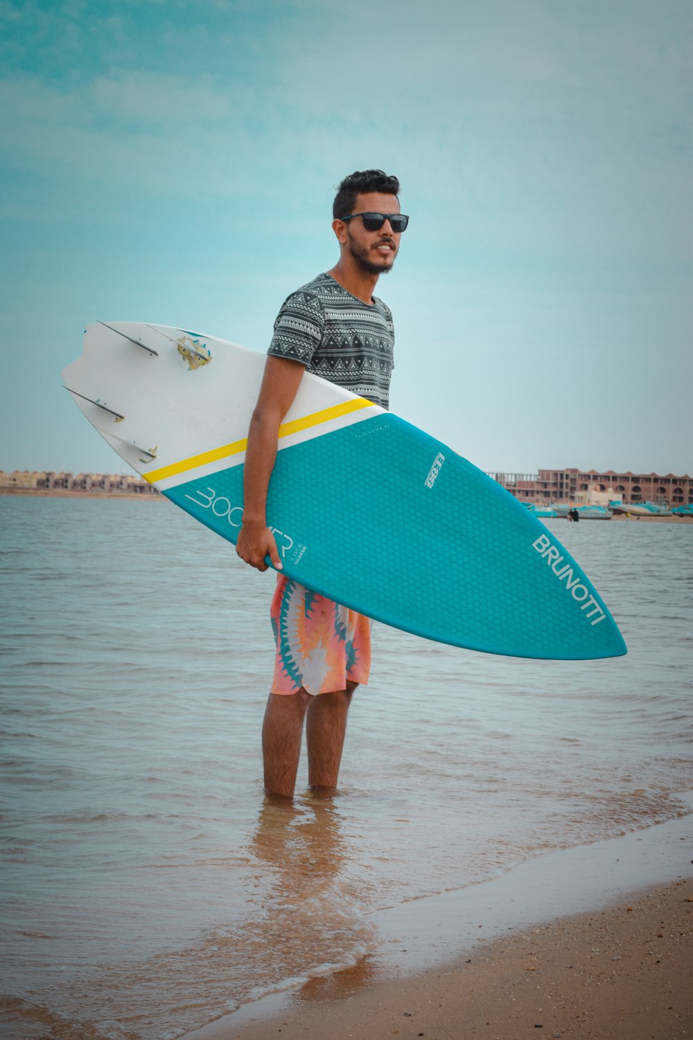 a man holding a surfboard