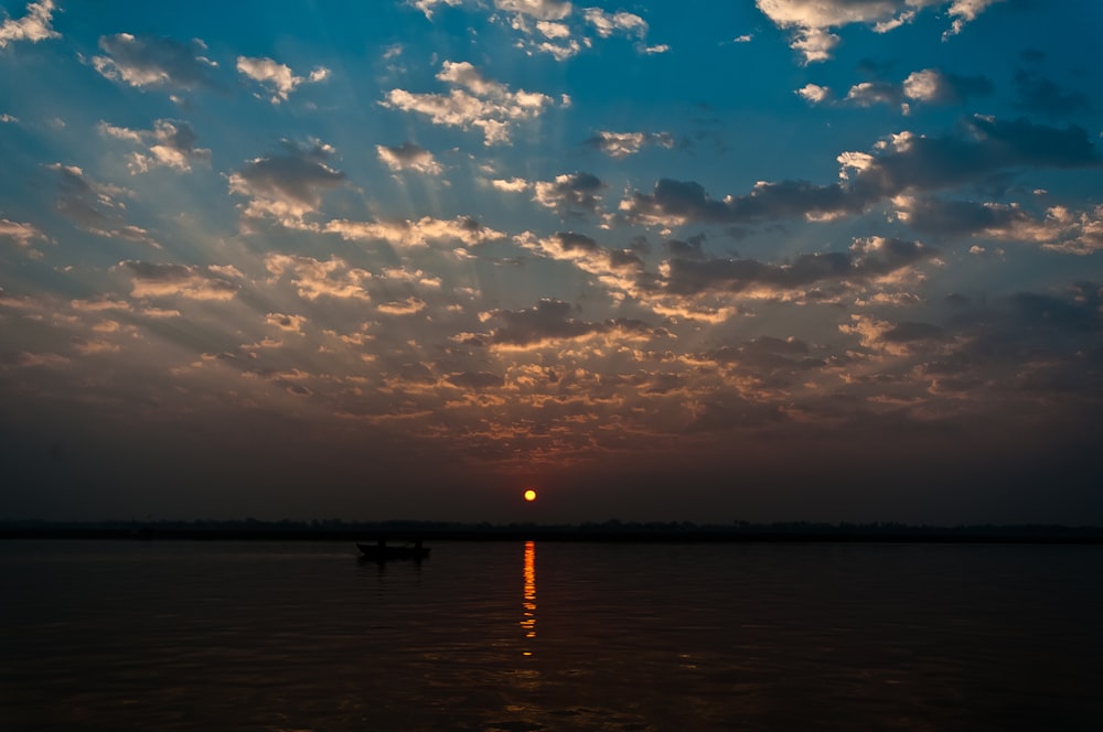 a sunset over a body of water