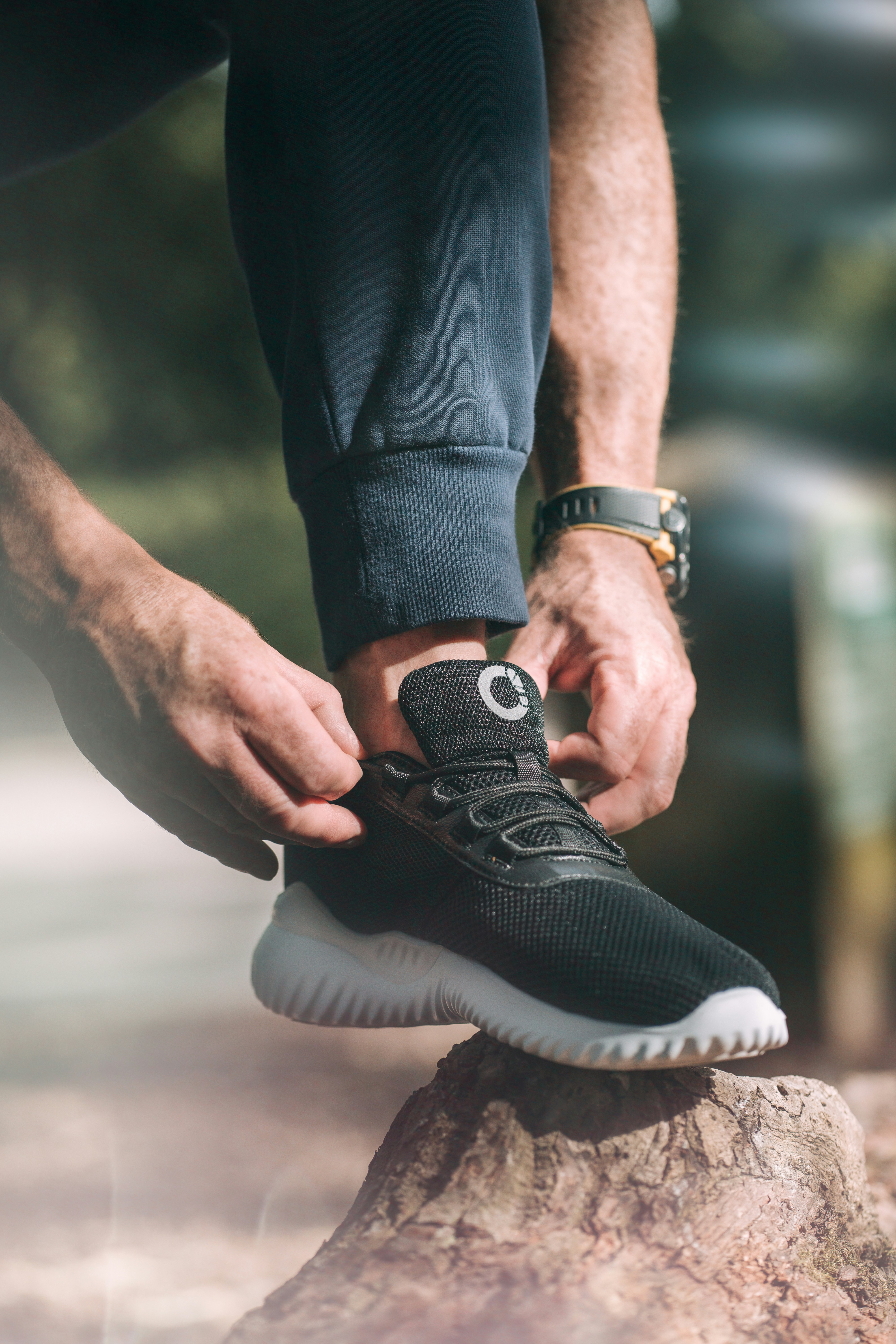 a person's feet on a rock