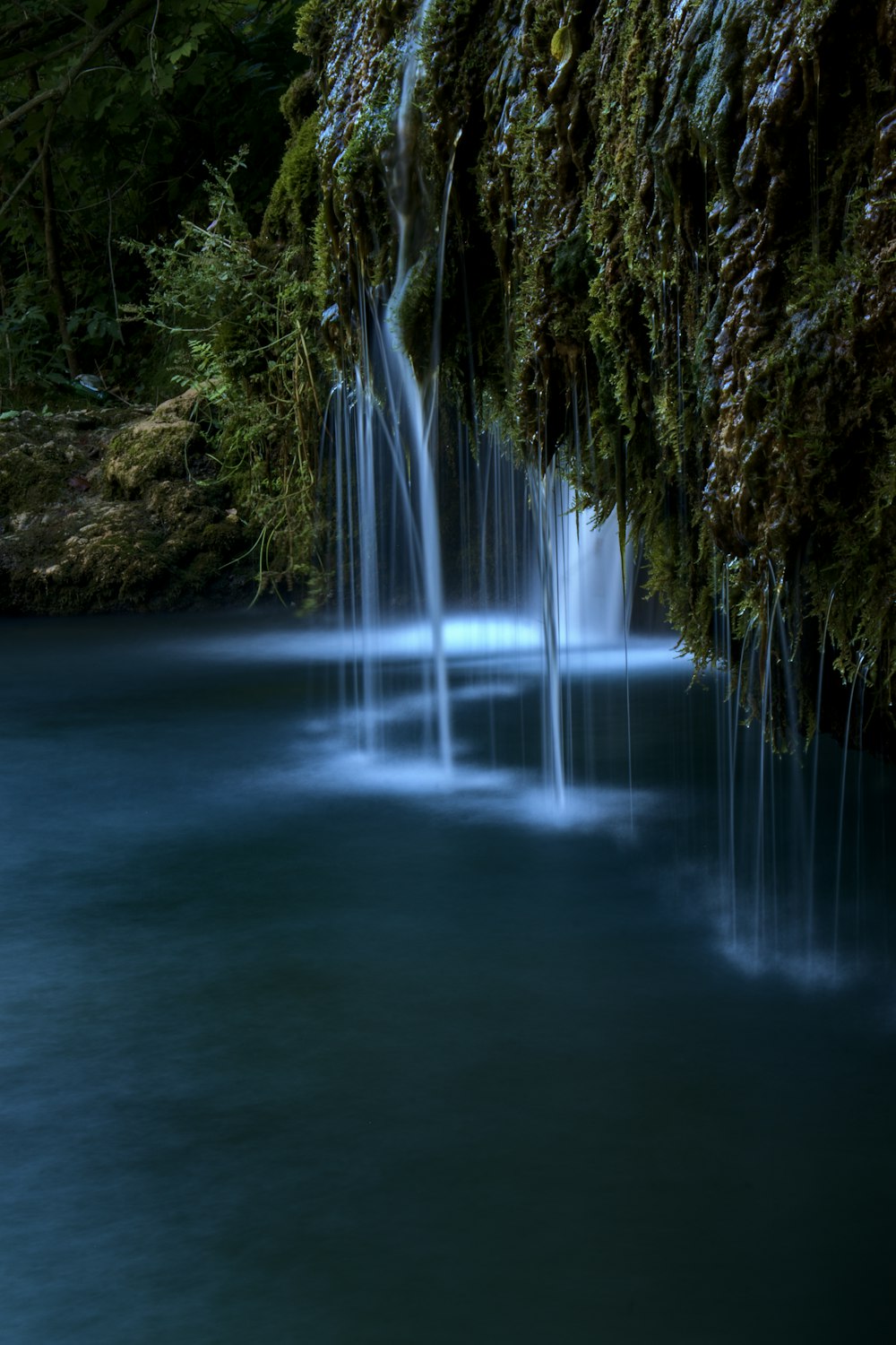 a waterfall in a forest