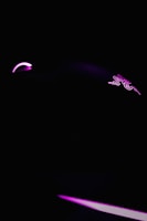A dark, minimalist scene featuring a gaming mouse highlighted with neon pink lighting. The mouse logo is faintly visible, and the overall ambiance is sleek and futuristic.