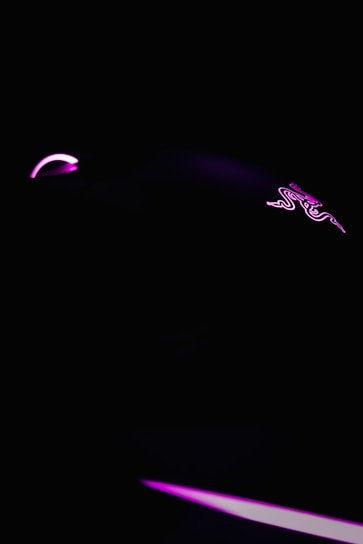 A sleek, dark-themed game interface glowing with neon blue and purple accents.