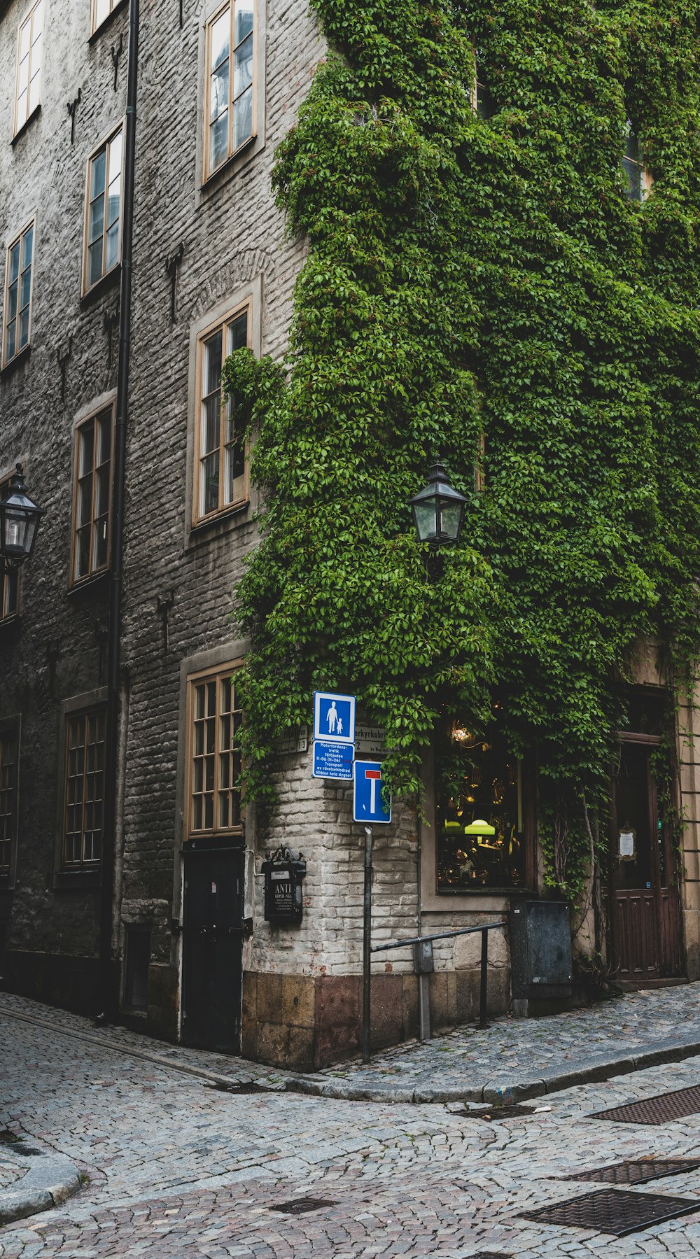 a brick building with trees on the side