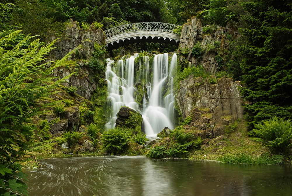 a bridge over a waterfall