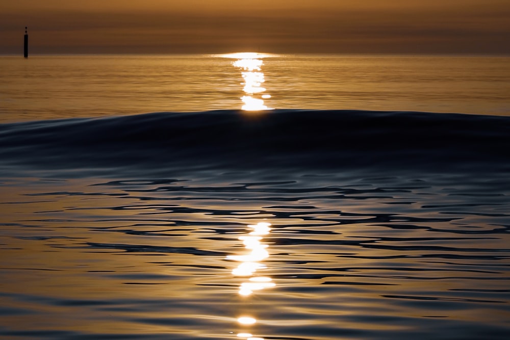 a sunset over a body of water