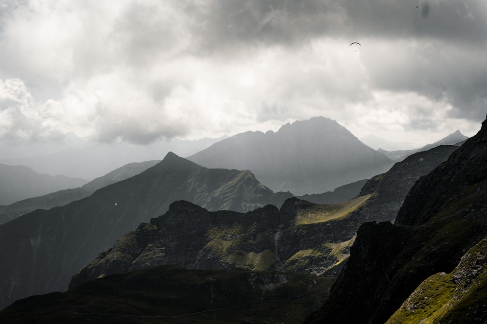 a mountain range with clouds