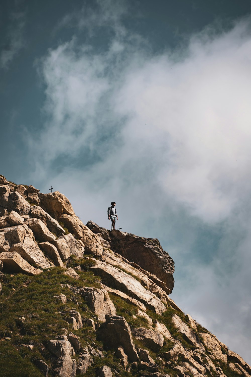 a person standing on a rocky hill