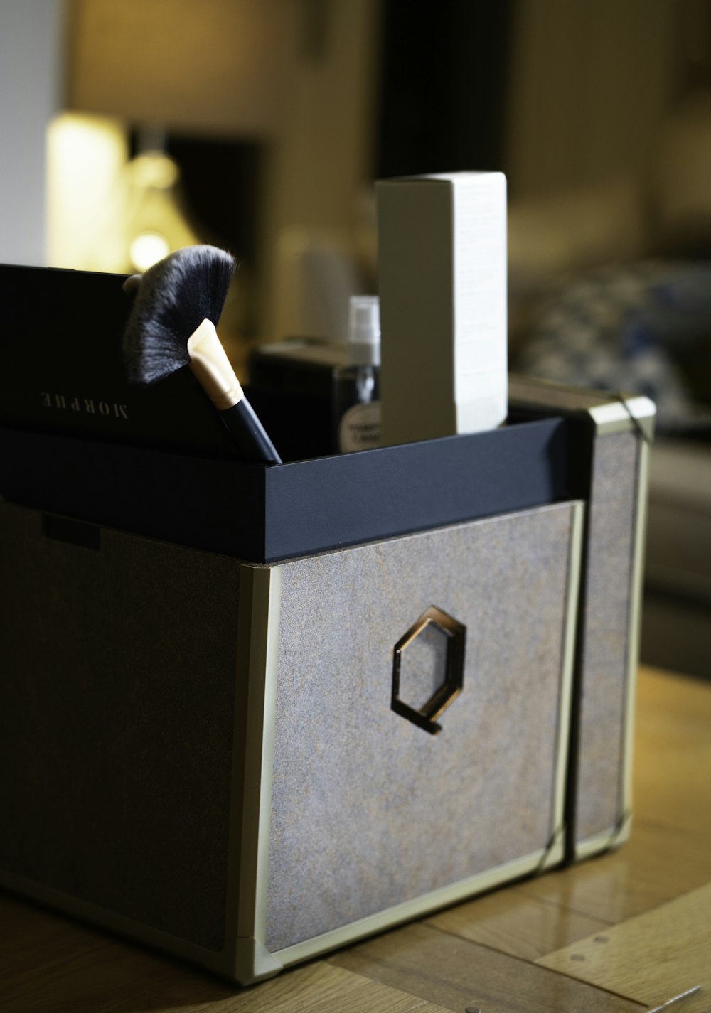 a black box with a white candle