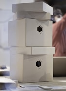 a stack of white boxes