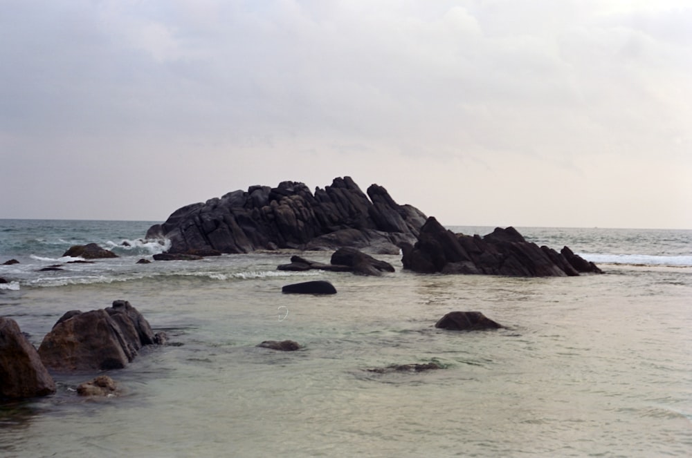 a rocky beach with waves crashing