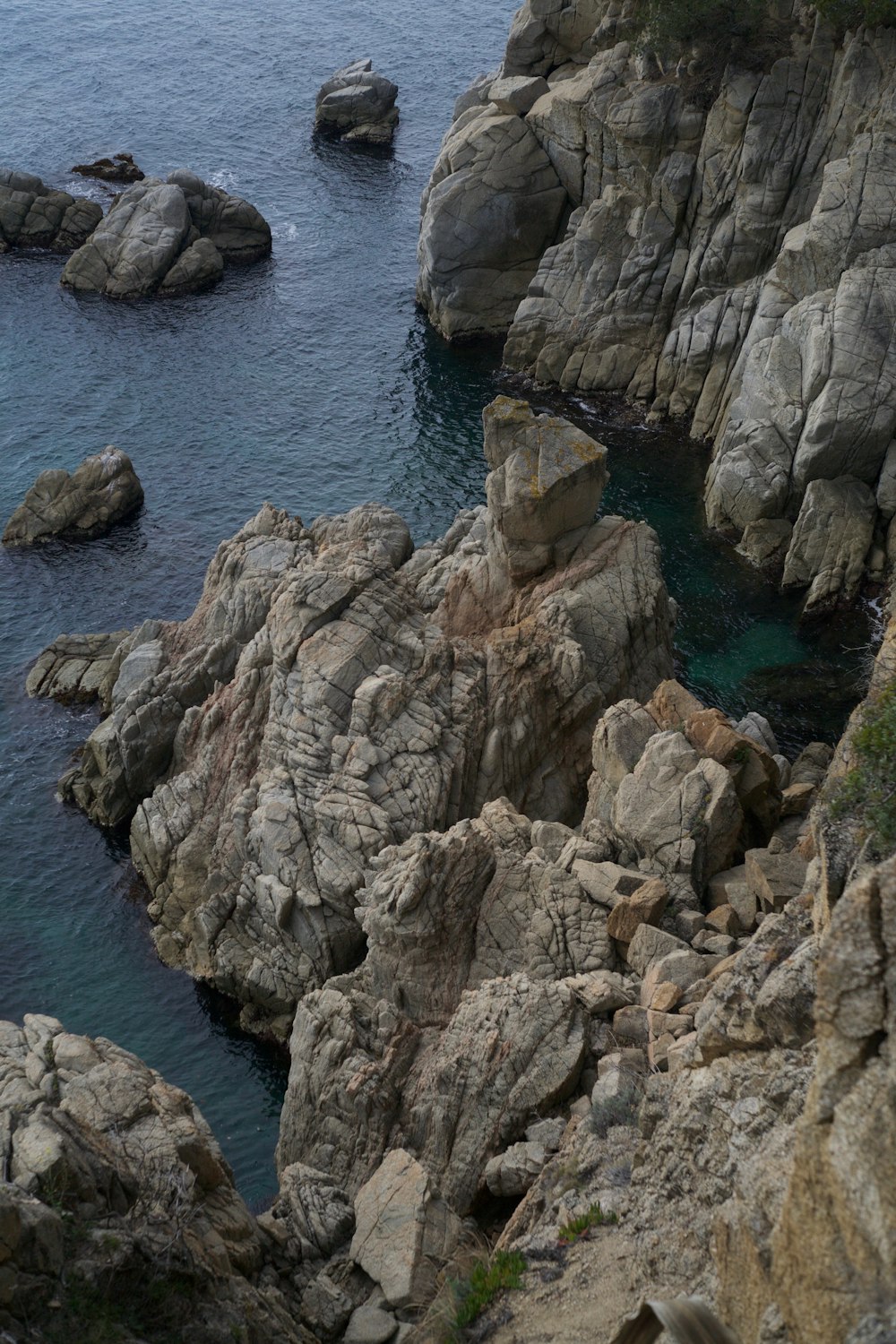 a rocky shoreline with water