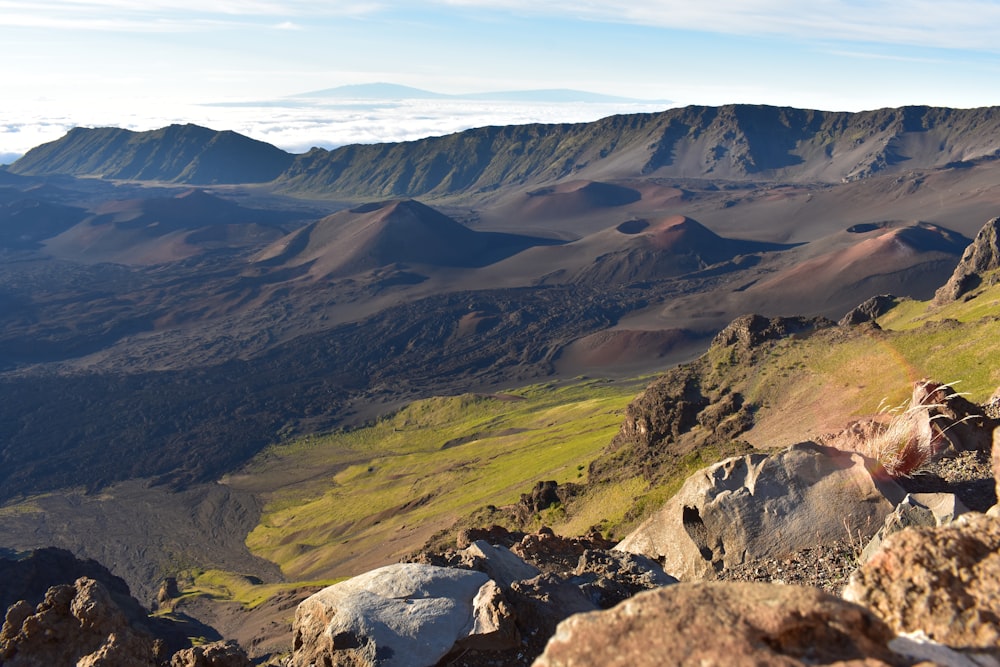 a valley with mountains in the background