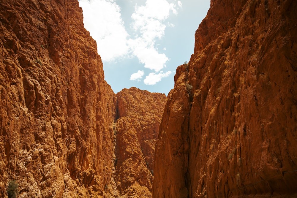 a rocky canyon with a blue sky