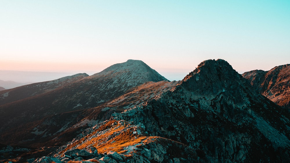 a mountain with a valley below