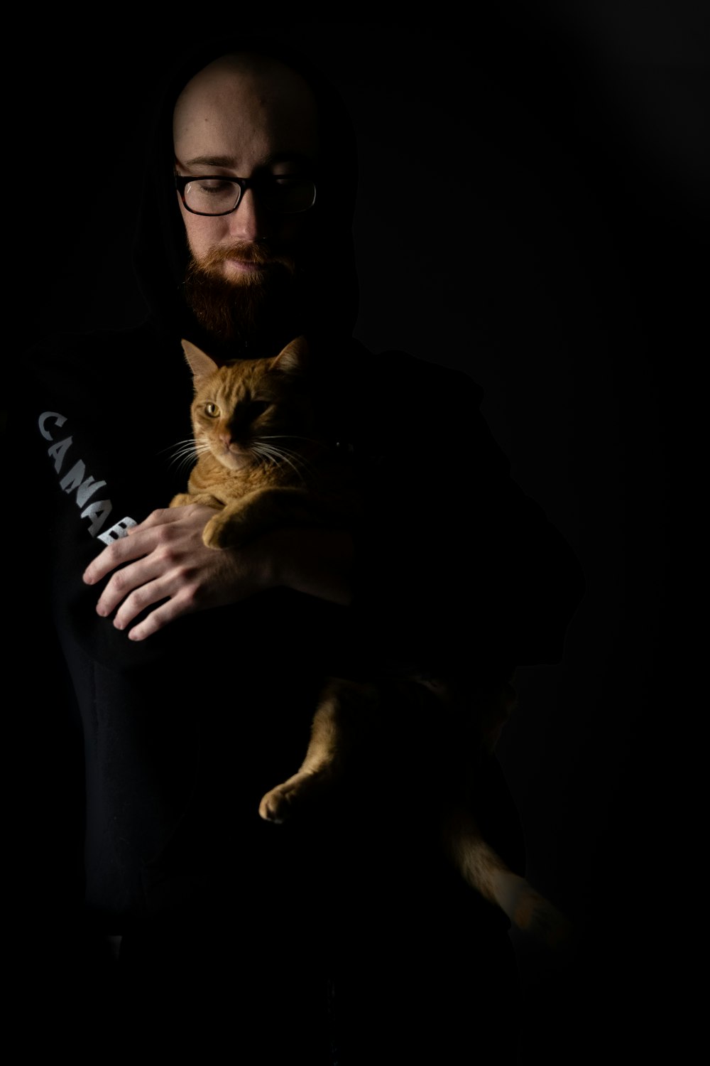 a man holding a cat