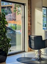 A bright and modern salon suite with stylish decor and ample natural light.