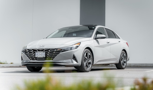 Front view of a clean, reliable used sedan parked outside Simple Auto Sales.