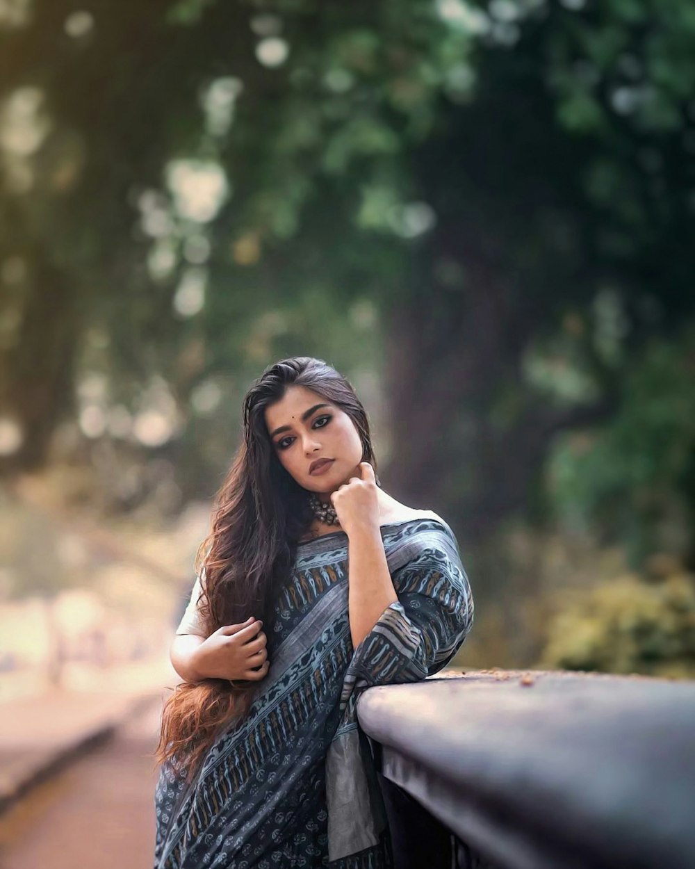 a person leaning on a car