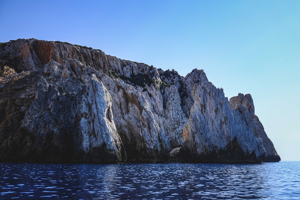 a large rock formation in the water