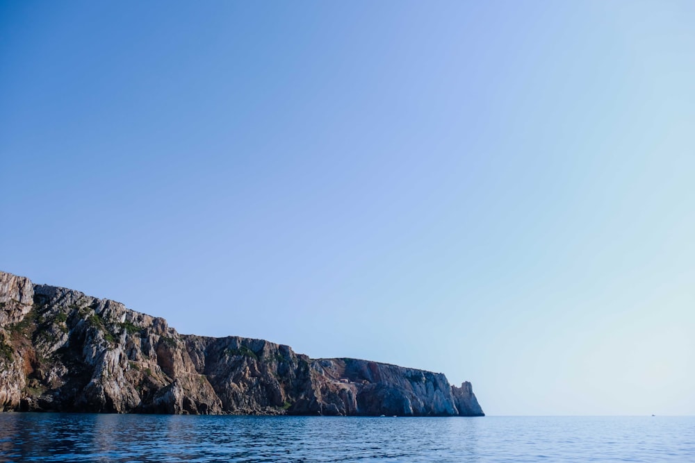 a rocky island in the water